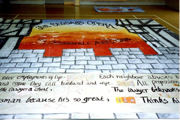 Hand painted backdrop of a castle and scripture made for The Beggars Opera